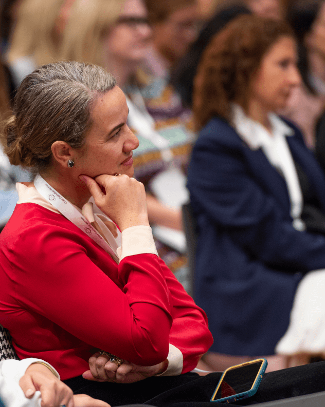 CEW member in thoughtful discussion at an event