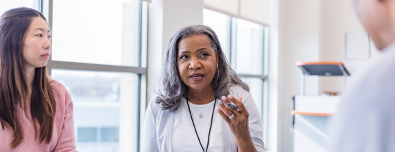 Women leaders engaged in conversation at a CEW event